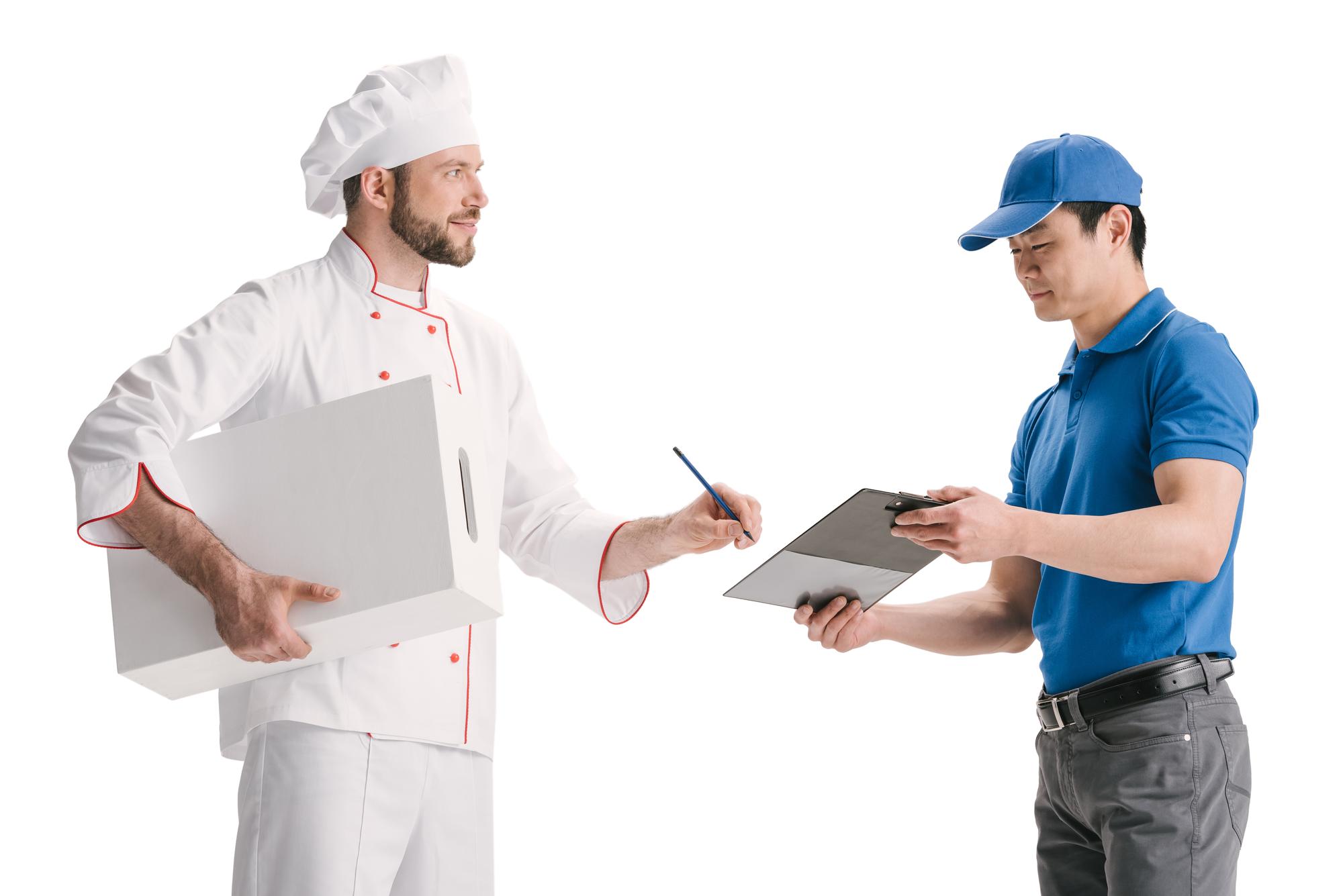 Consultant advising kitchen staff during service